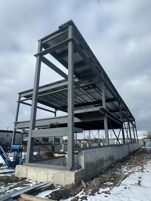 Multi-level steel frame with columns, open-web joists and corrugated deck — Racine Road